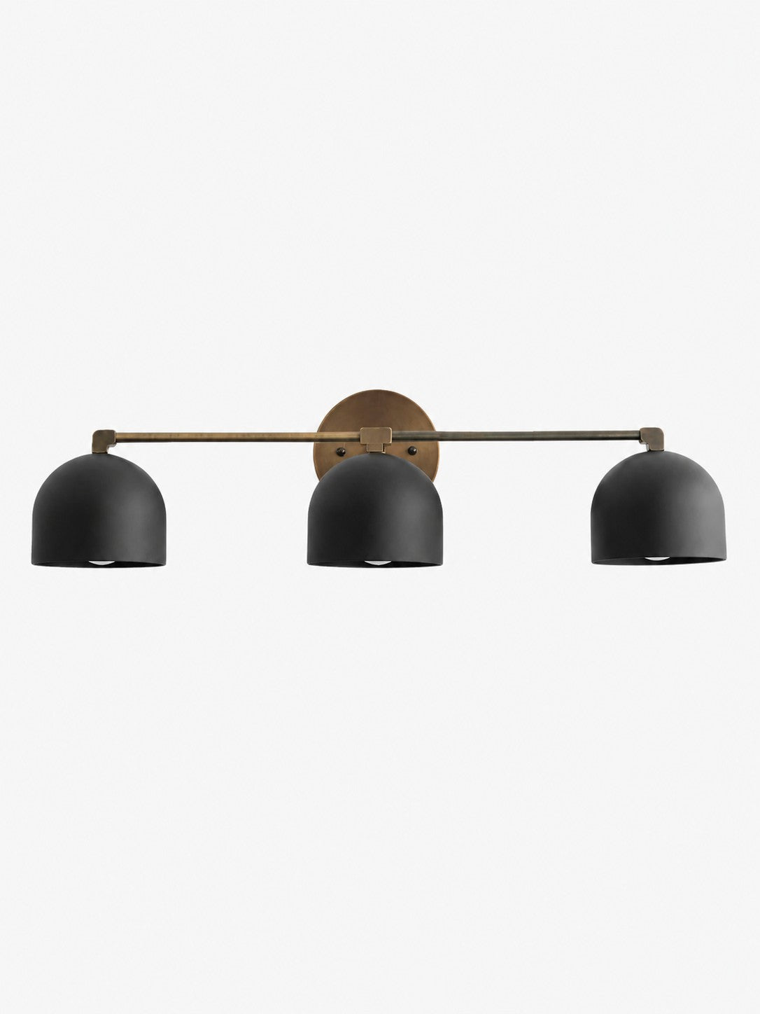Meda dome vanity wall light detail of the brass arm and dome shade