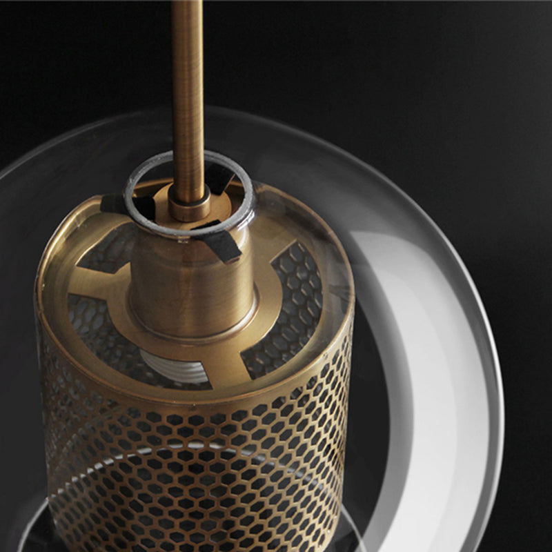 Close detail of the Hesso brass lamp holder and perforated mesh cylinder