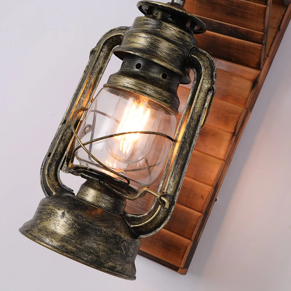 Close detail of the Kenva lantern wire guard, clear glass chimney and antique bronze body