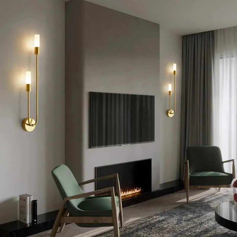 Vano gold sconces flanking fireplace in living room