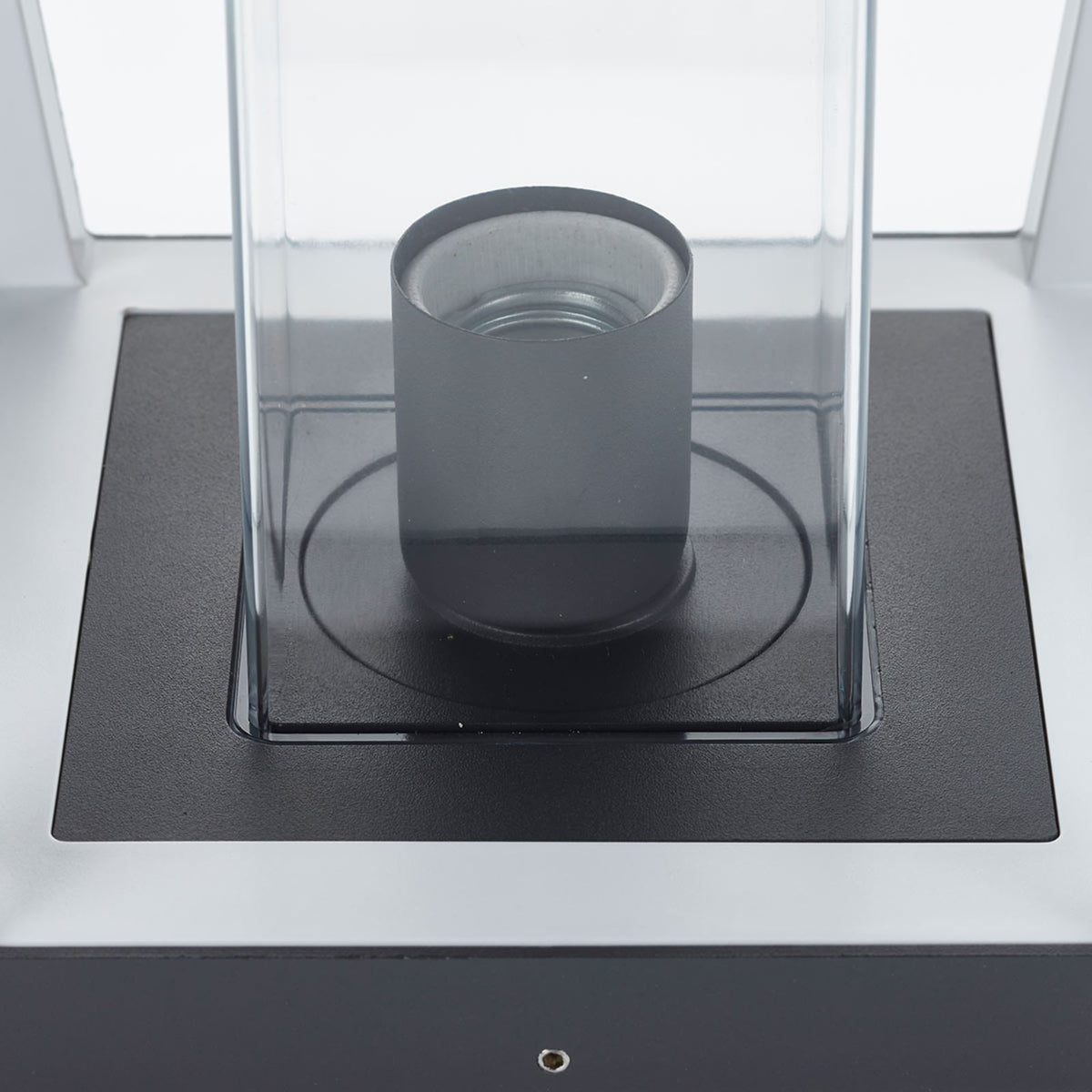 Close detail of the Dunara E27 lamp holder mounted on the black base plate