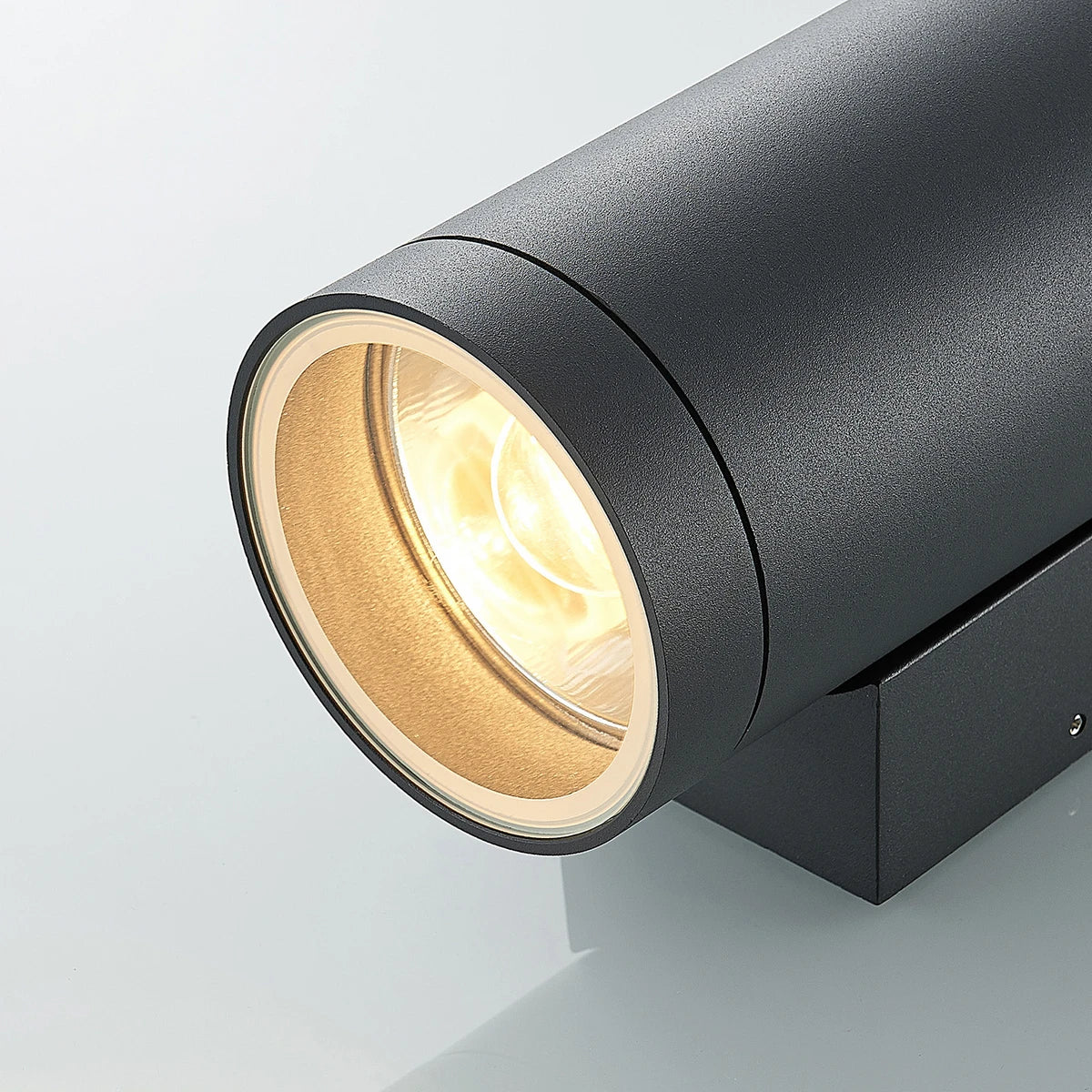 Close-up of the Tovi outdoor wall light showing the safety glass and E27 lamp opening