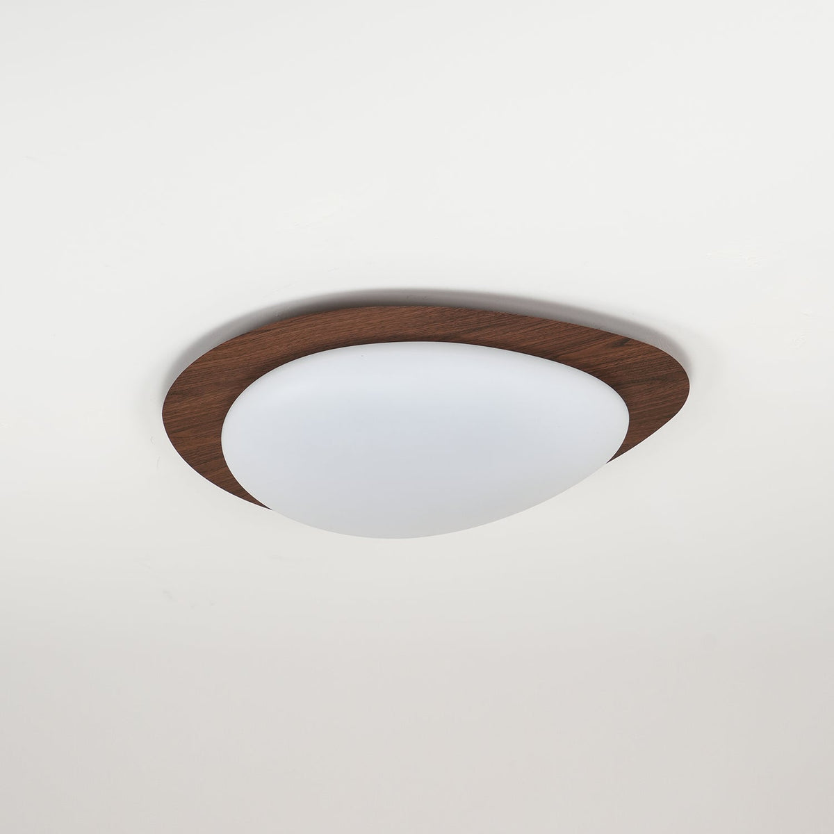 Side profile of the Quisto Pebble Walnut Ceiling Light showing the shallow 8 cm depth