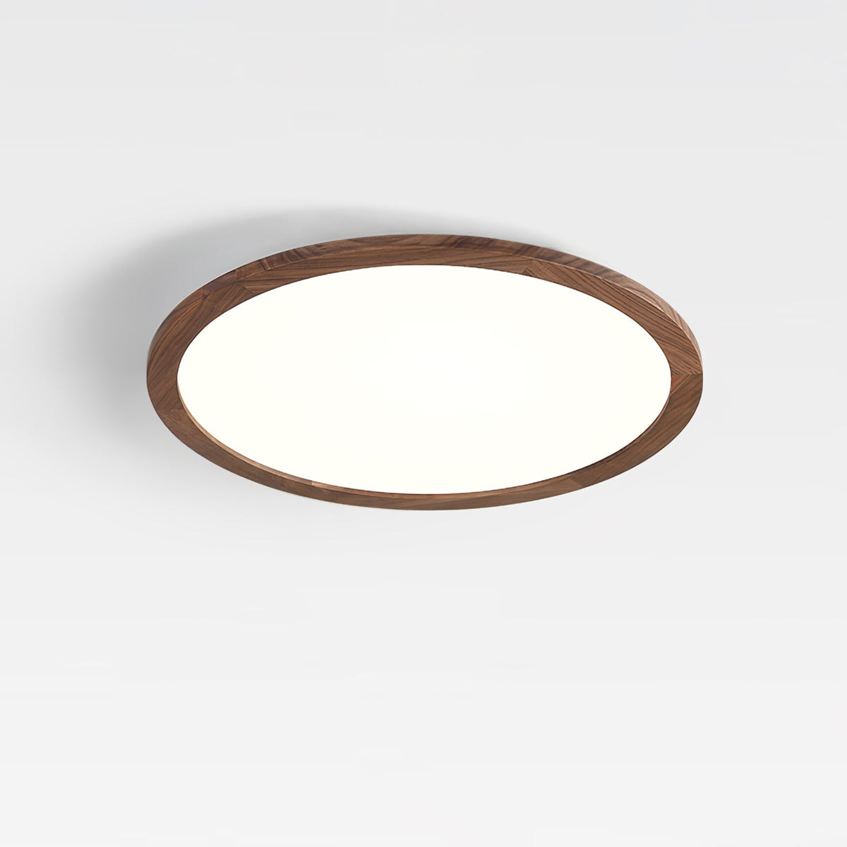 Ivero Ultra-Slim Ceiling Light lit and viewed at an angle against a pale ceiling