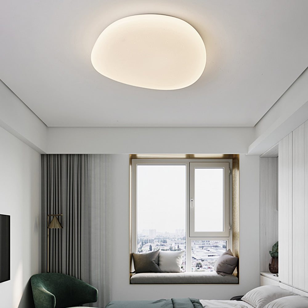 Sayen ceiling light lit in a bedroom with a window seat