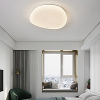 Sayen ceiling light lit in a bedroom with a window seat