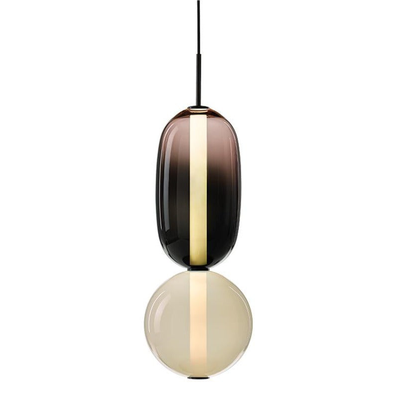 Ambero amber glass pendant light on a white background, smoked amber oval shade above an opal glass globe