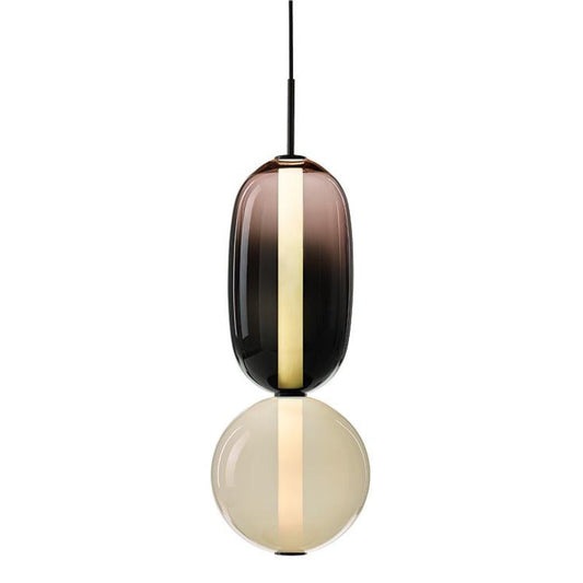 Ambero amber glass pendant light on a white background, smoked amber oval shade above an opal glass globe