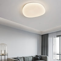 Sayen pebble ceiling light in a living room with a sofa and curtains