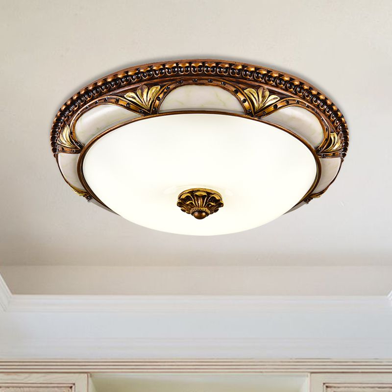 Close view of the Epora Antique Brass Ceiling Light showing the cast floral detail on the rim