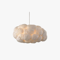 Nuvo cloud pendant light on a plain background, white cotton cloud shade lit warm from inside