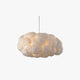 Nuvo cloud pendant light on a plain background, white cotton cloud shade lit warm from inside