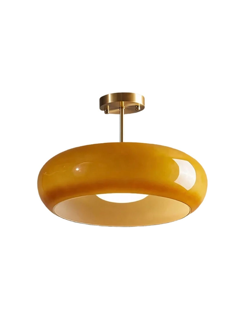 Bardo brass and amber glass disc ceiling light on a plain white background