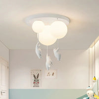 Wisto ceiling light seen from below, showing the round white ceiling plate, three balloon shades and hanging bears