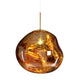 Milto gold pendant light with a molten shaped mirrored acrylic shade lit from within, on a plain white background