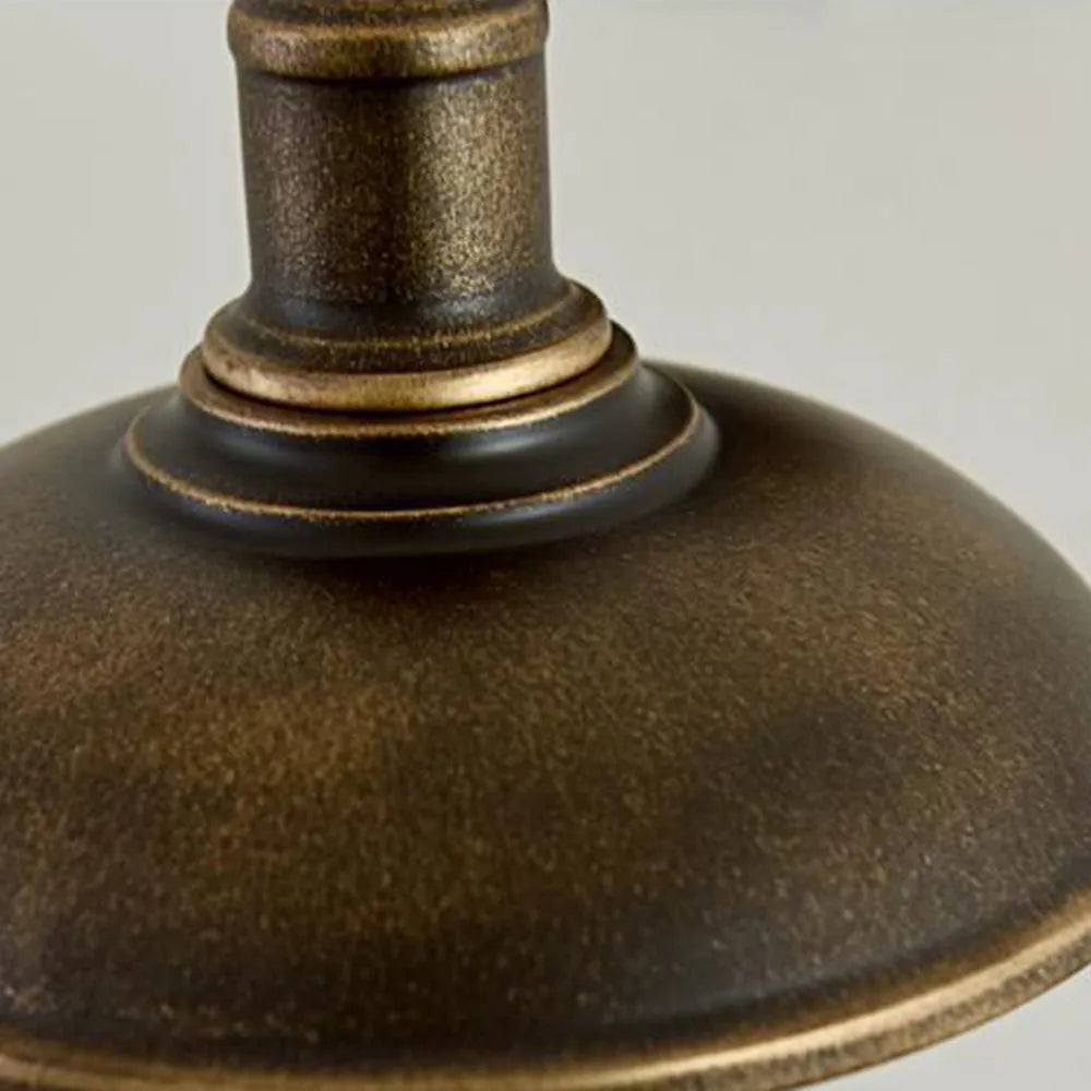 Close detail of the ribbed collar and antique brass finish on the Bolva bowl shade