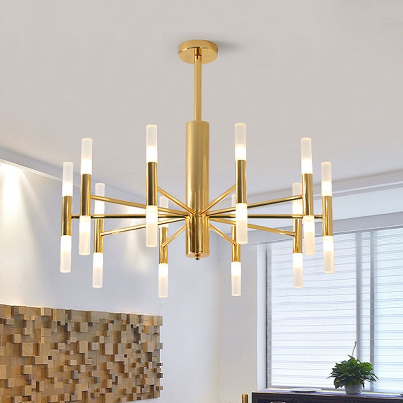 Cylma gold ceiling light lit in a bright living room beside a window and a timber wall panel