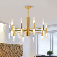 Cylma gold ceiling light lit in a bright living room beside a window and a timber wall panel