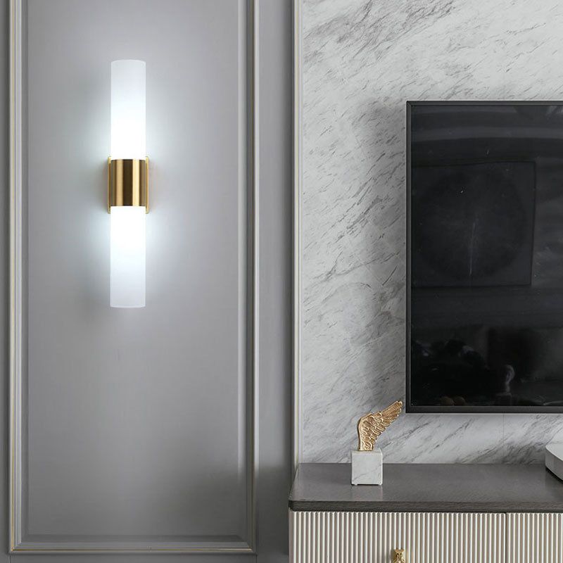 Fela sconce on marble feature wall next to TV