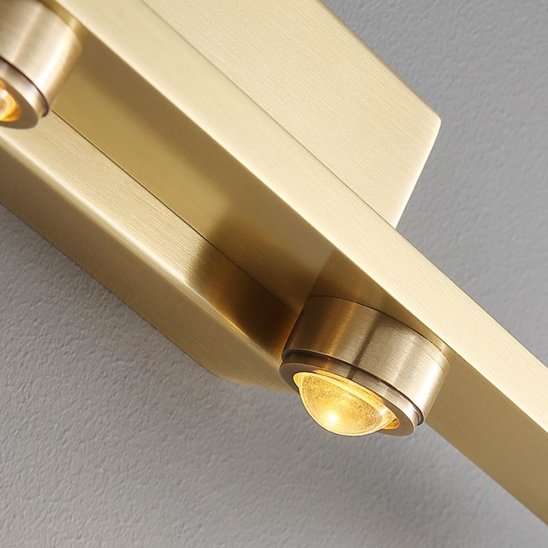 Detail of a single ripple lens spotlight on the Nolvo brass vanity wall light