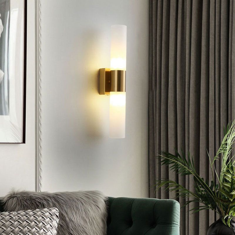 Fela wall sconce in living room warm brass finish