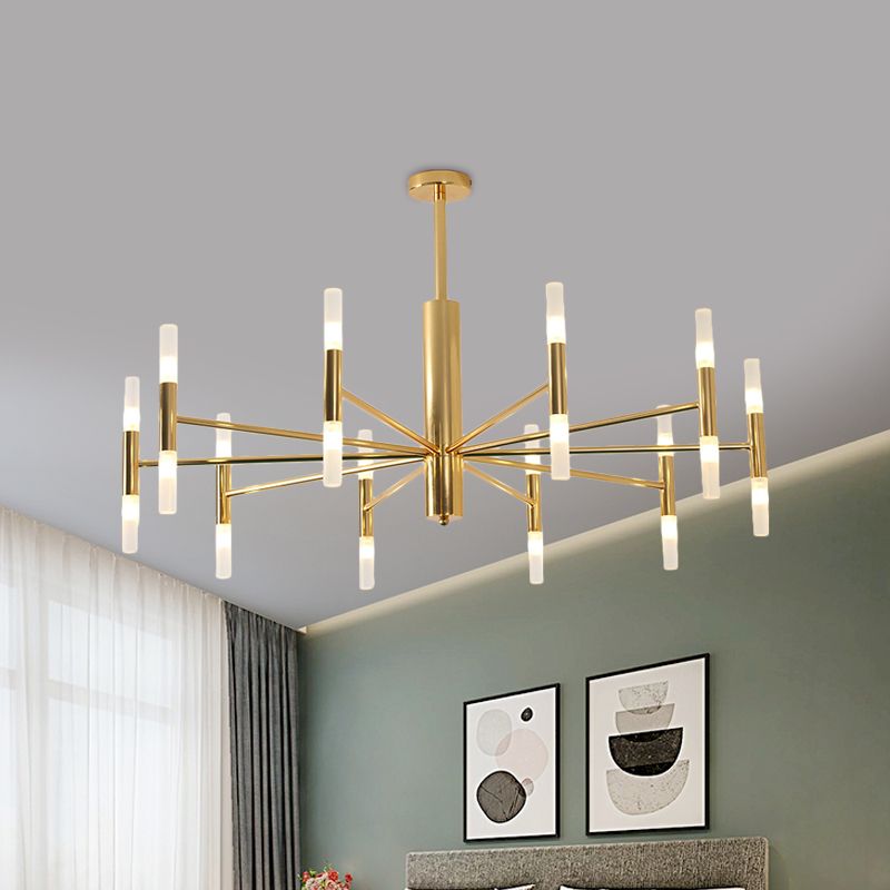 Cylma gold cluster ceiling light in a bedroom with a sage green wall and framed prints