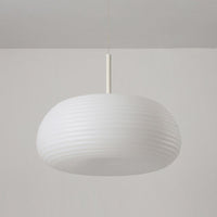 Ombia pendant unlit in daylight, showing the vertical ribs across the white acrylic shade
