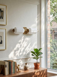 Lanto Horizontal Milk Glass Wall Light mounted on a panelled wall above a walnut sideboard