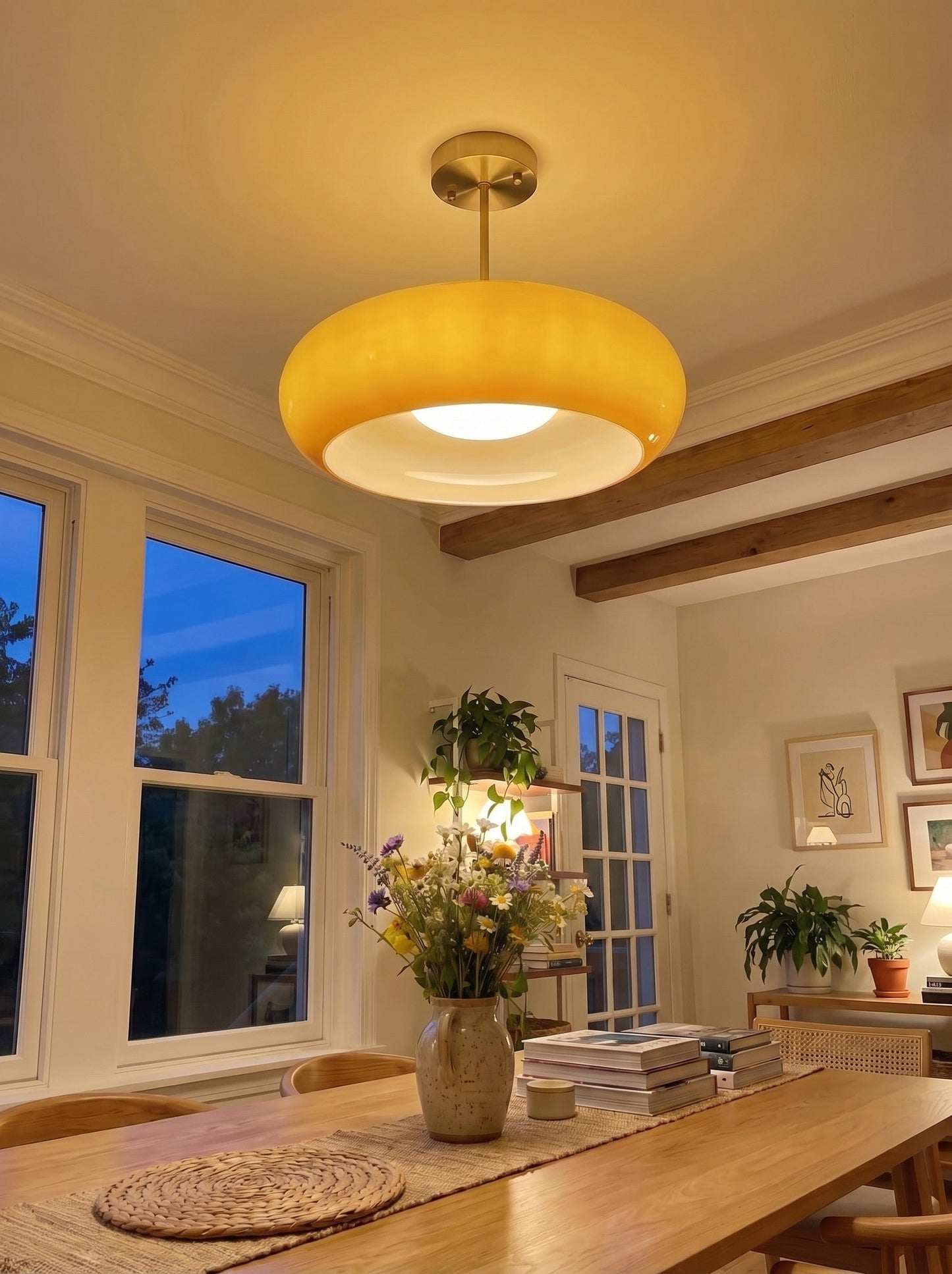 Bardo ceiling light glowing warm above a dining table in the evening