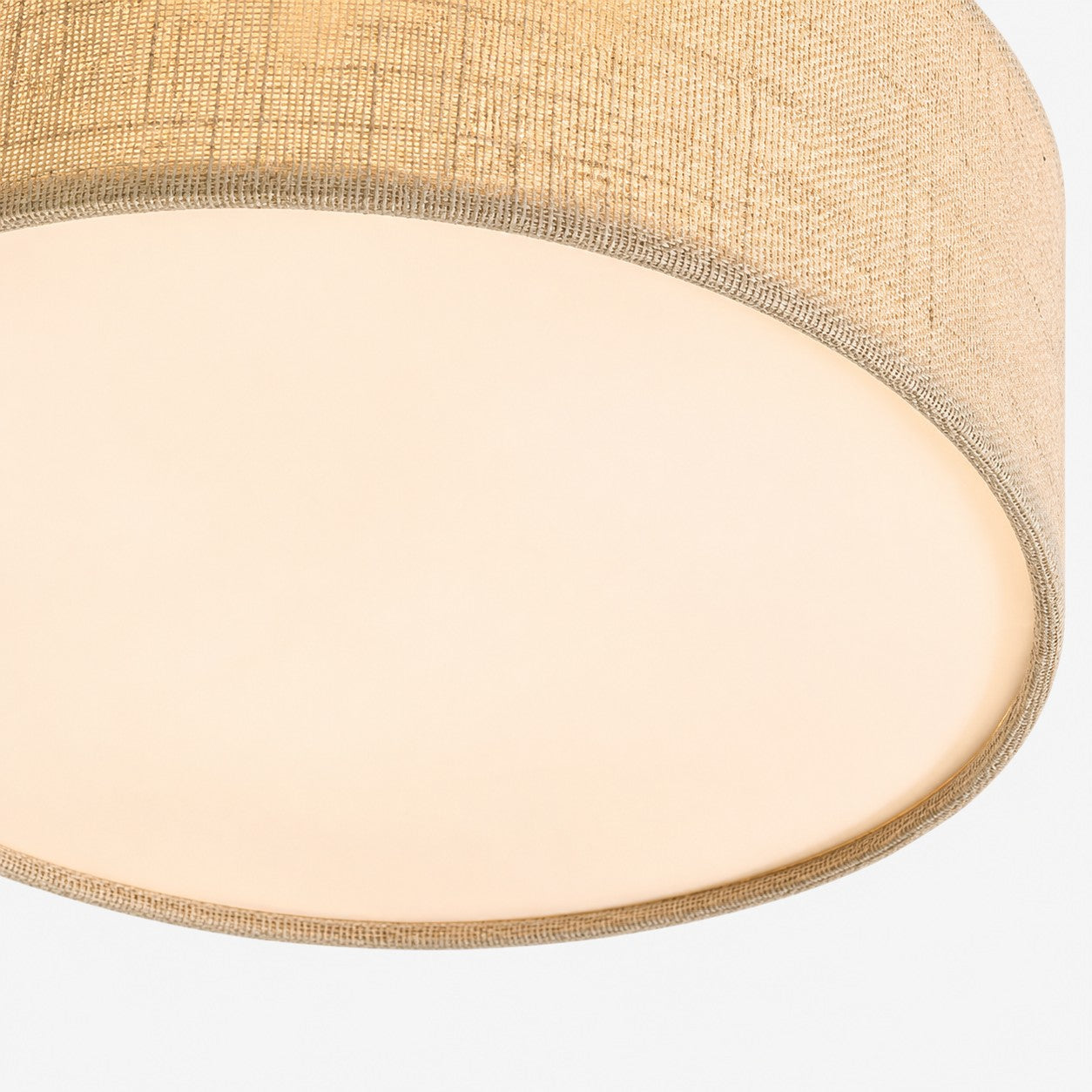 Close detail of the woven flax fabric shade and base diffuser on the Duma ceiling light