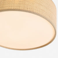 Close detail of the woven flax fabric shade and base diffuser on the Duma ceiling light