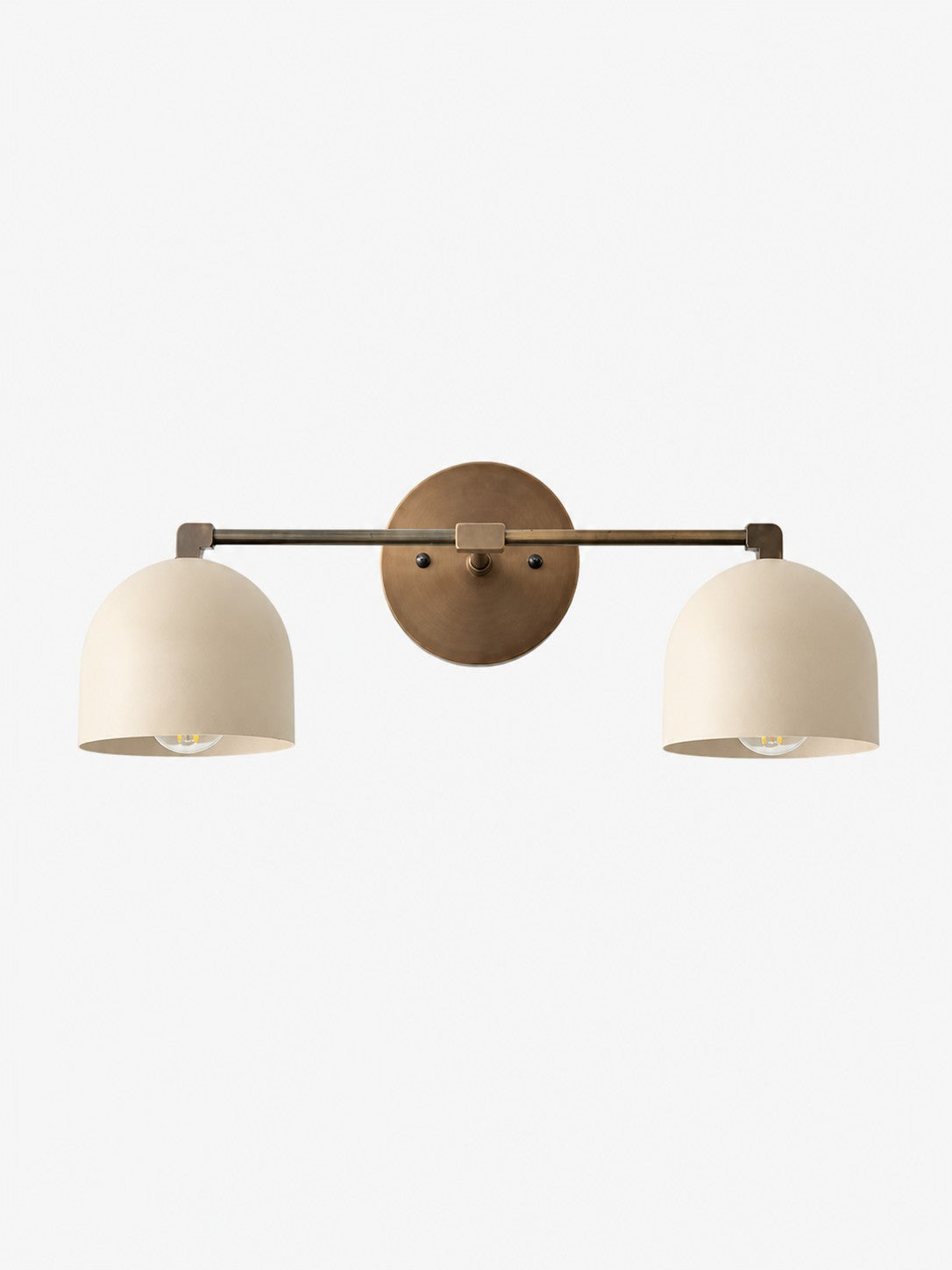 Meda two head dome vanity wall light with white shades and antique brass arm