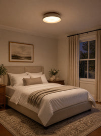 Trava travertine ceiling light casting warm light in a bedroom