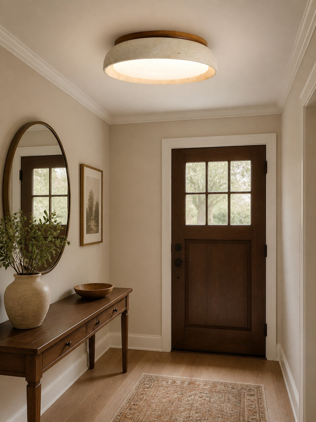Trava travertine ceiling light lit above an entryway console table
