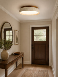 Trava travertine ceiling light lit above an entryway console table