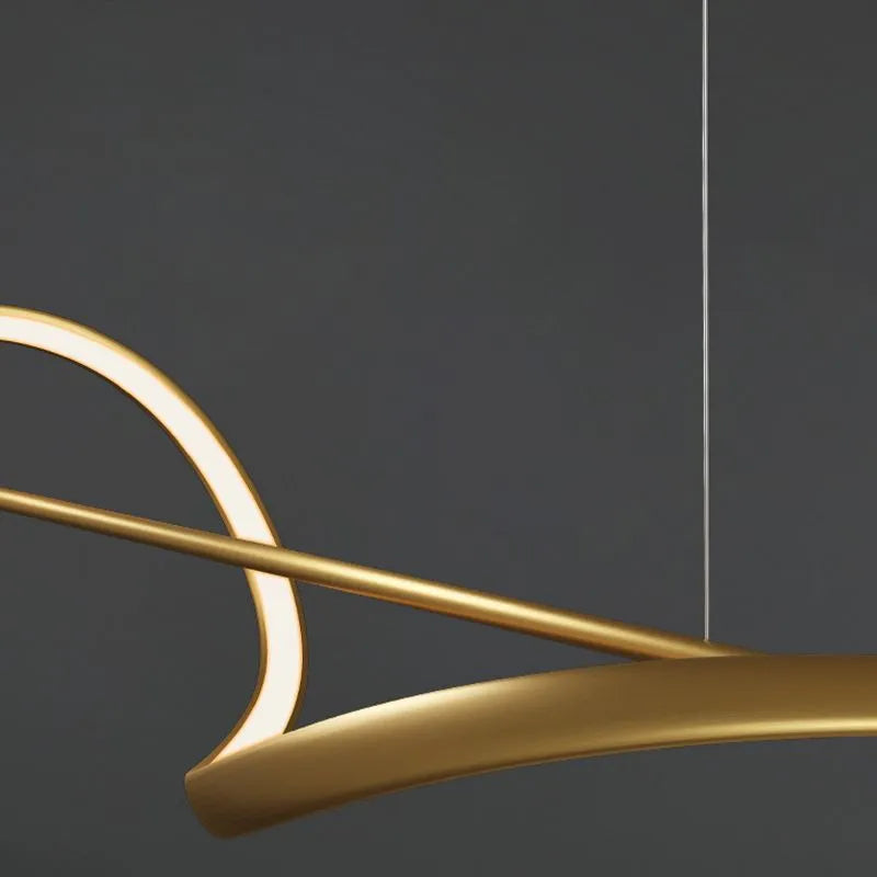 Close up of the brushed gold ribbon and lit silicone channel on the Kavro pendant