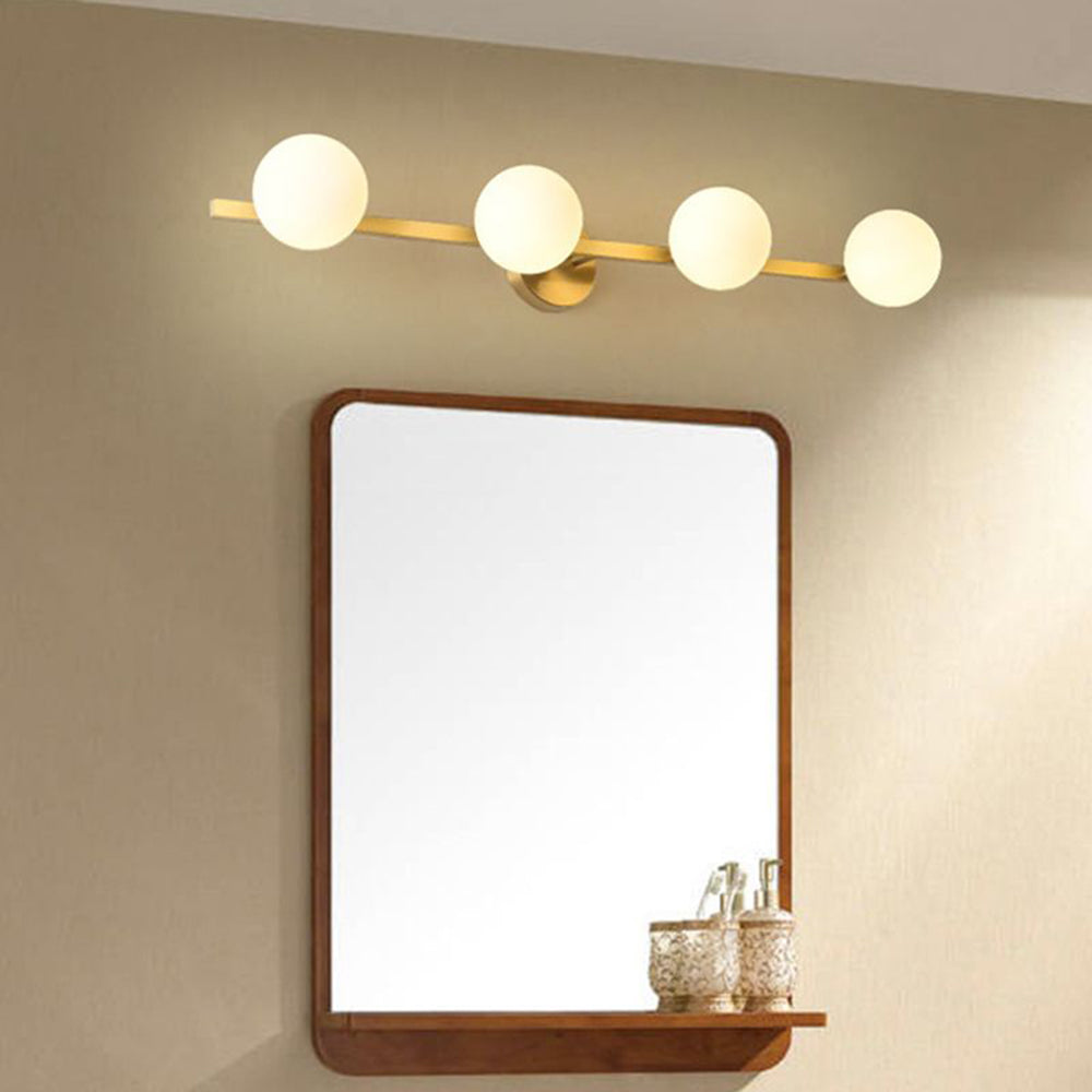 Sevra vanity light mounted above a rectangular wooden framed mirror with a shelf