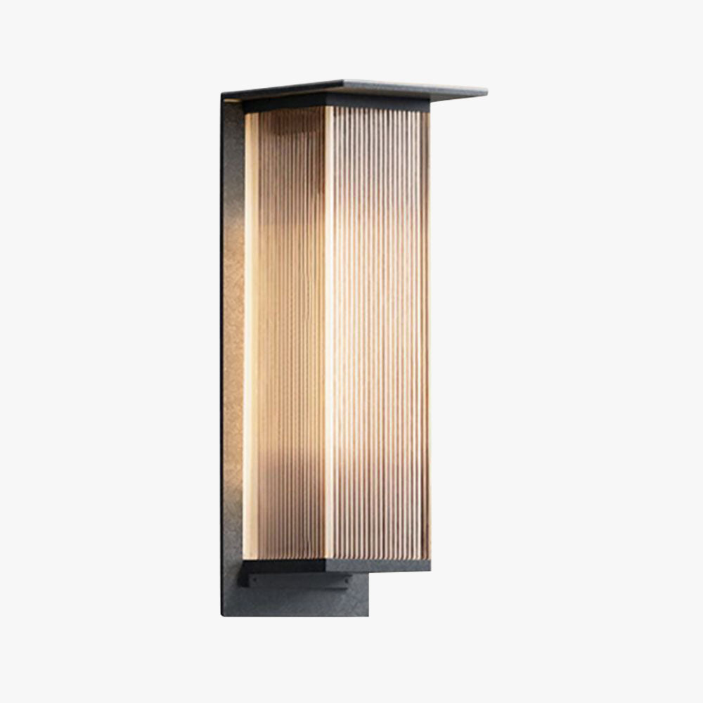 Rekta Rectangular Outdoor Wall Light in black with ribbed diffuser lit warm on white background