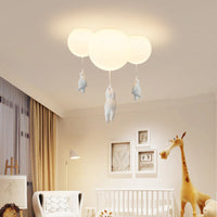 Wisto bear and balloon ceiling light fitted in a nursery above a cot with a giraffe toy