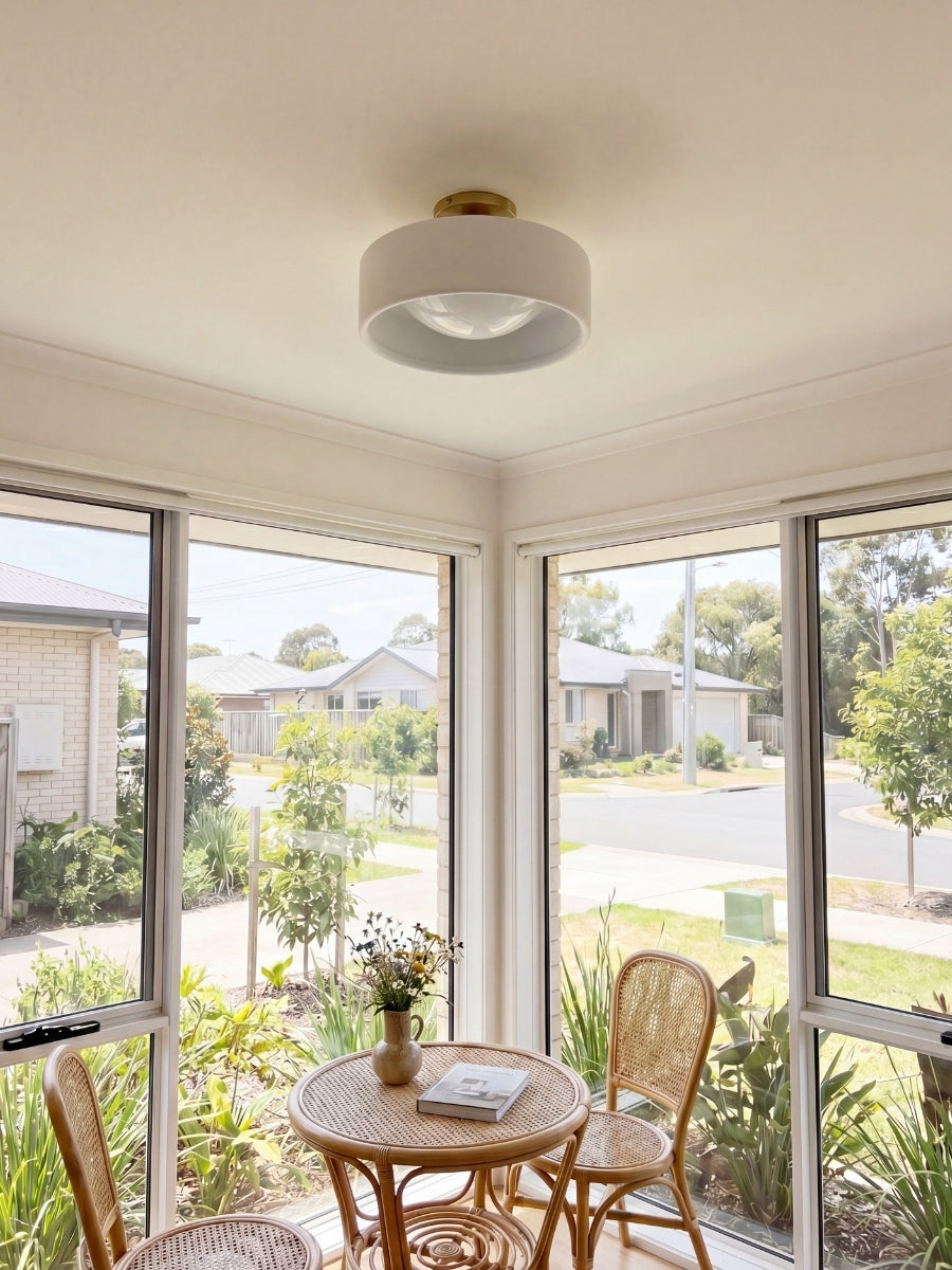 Cera porcelain flush ceiling light in a bright breakfast room