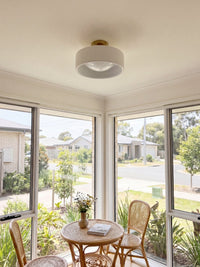 Cera porcelain flush ceiling light in a bright breakfast room