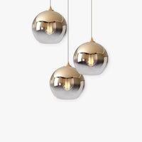 Orba gradient glass globe pendant lights in gold, plain background