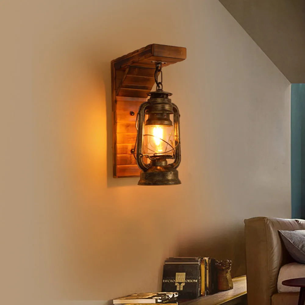 Pair of Kenva lantern wall lights lit above a bed against a textured plaster and brick wall
