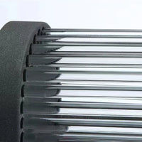 Close detail of the fluted glass rods and black metal frame of the Yoro outdoor wall light