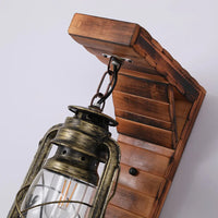 Angled view of the Kenva pine bracket and chain suspension above the bronze lantern