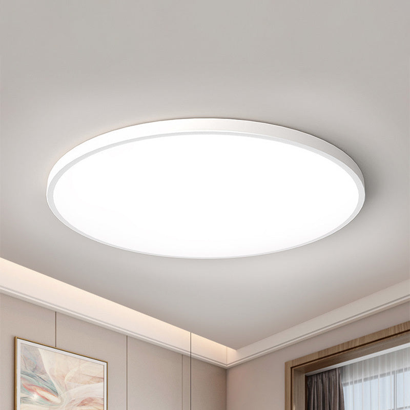 Yano slim white ceiling light casting even light across a pale living room ceiling