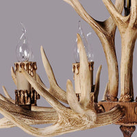 Close-up of the moulded resin antler arms and candle sleeve on the Stagra chandelier