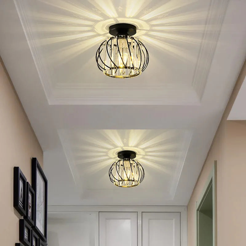 Two Relia black crystal ceiling lights on a panelled hallway ceiling
