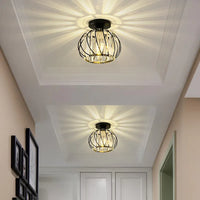 Two Relia black crystal ceiling lights on a panelled hallway ceiling