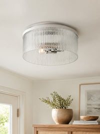 Close view of the fluted glass drum and nickel band on the Riva ceiling light